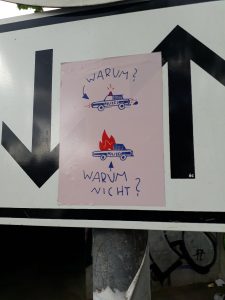 WARUM? WARUM NICHT? Sticker an der Münchner Isar